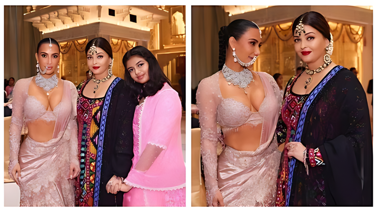 Kim Kardashian posing with Aishwarya Rai and her daughter at the Ambani wedding in Mumbai, showcasing elegance and glamour in traditional attire.